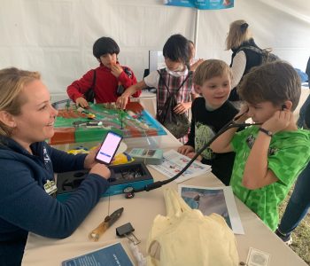 Celeste Parry, NMMF's Director of Community Engagement, sparks curiosity and passion for STEM through engaging science activities with students at SEWE.